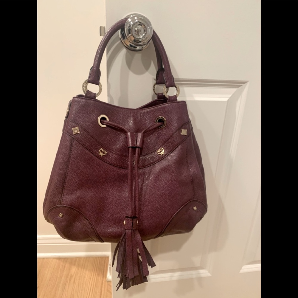 MCM Bag. 12 inch by 10 inch purple leather bag.